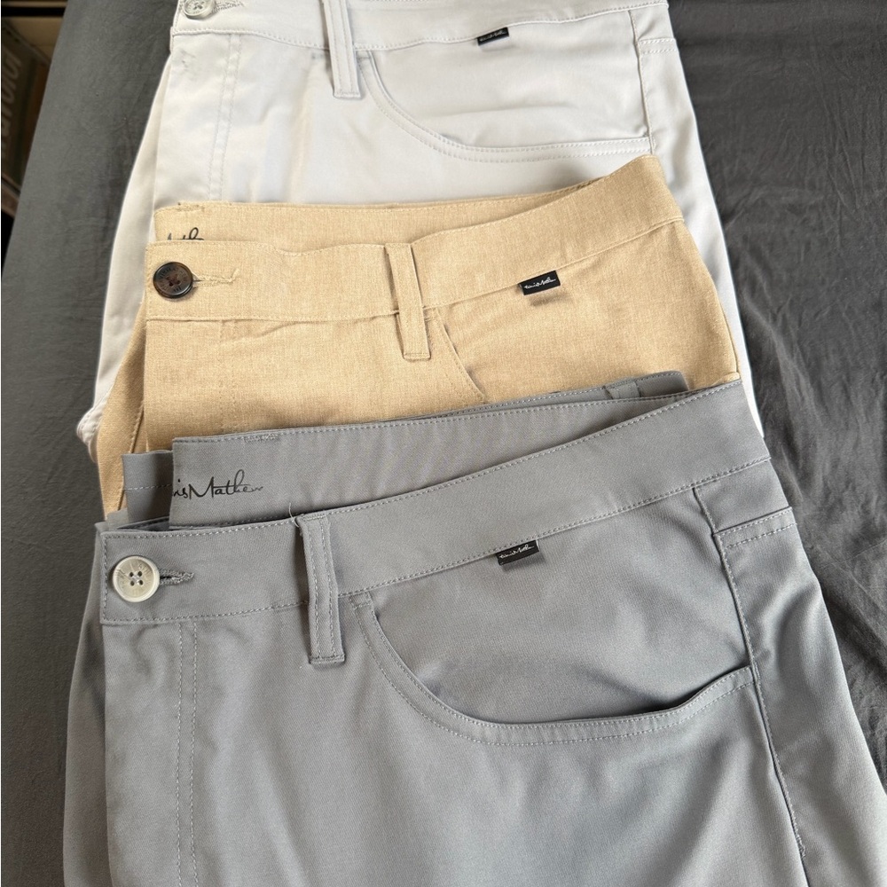 Travis Mathew Three-Pack Chinos in Gray, Tan, and White Golf Pants Bundle